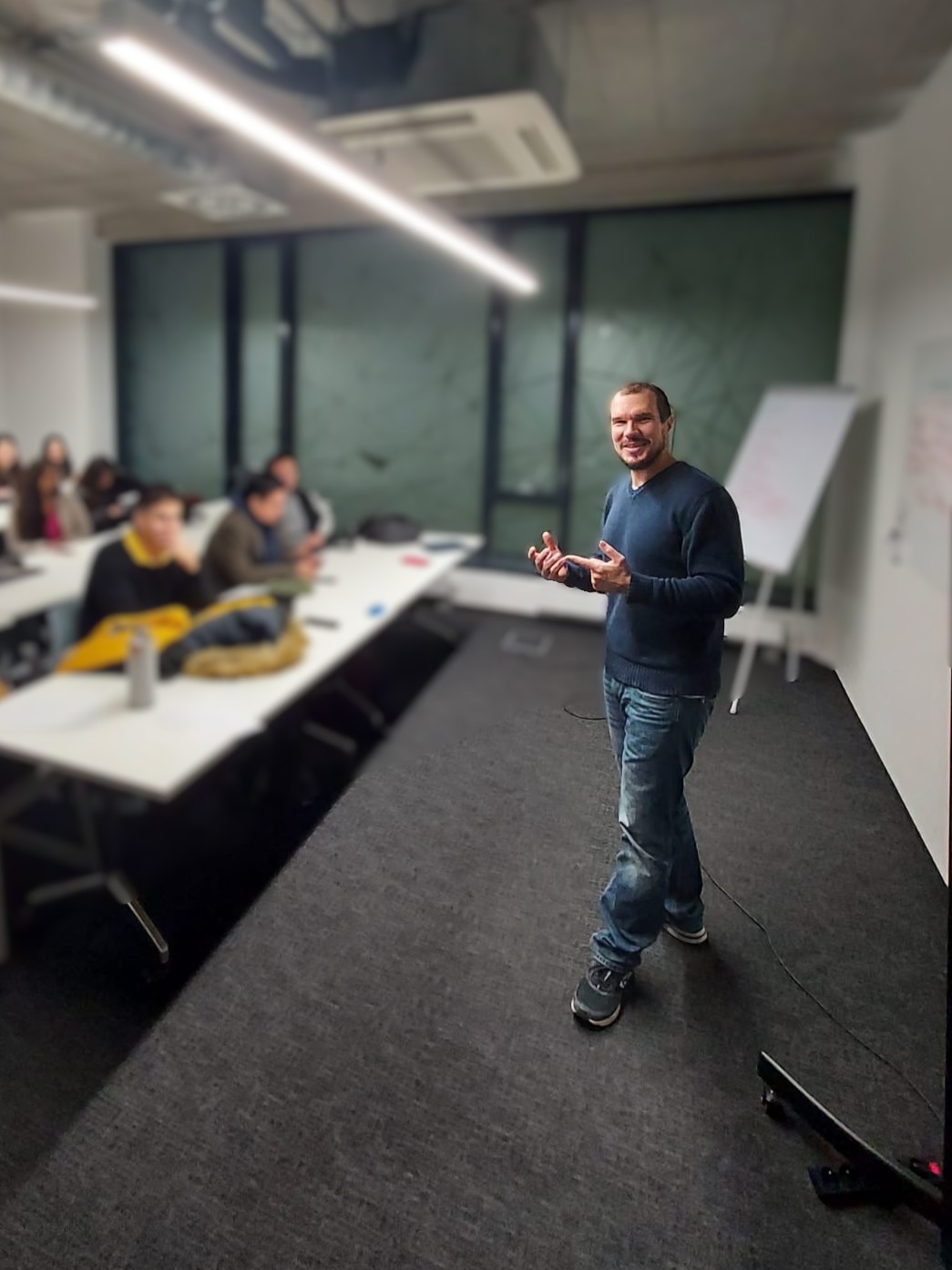 Brano delivering a lecture to an audience